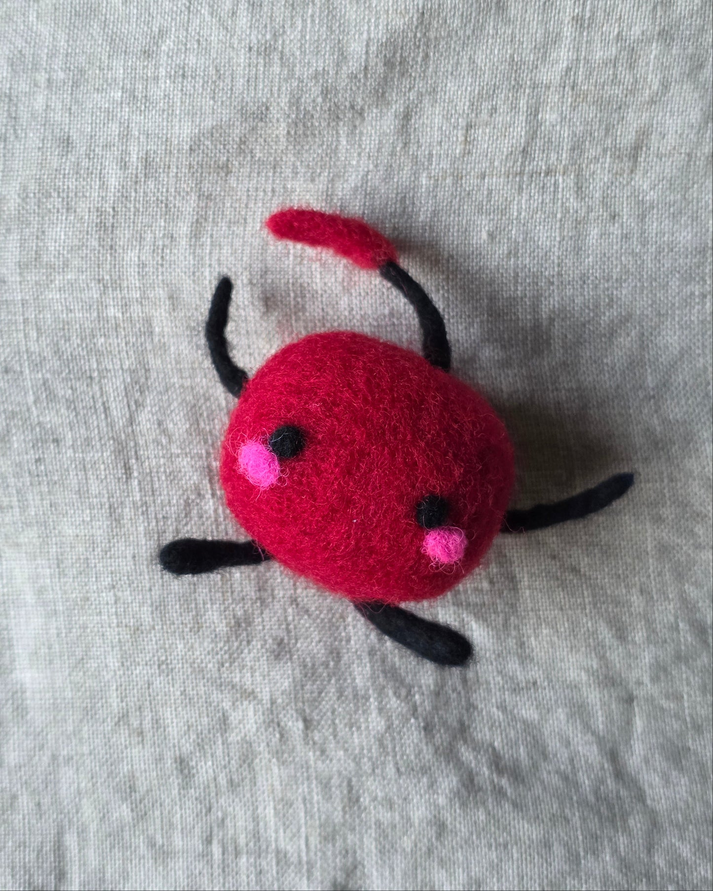 An adorable felted Junimo.