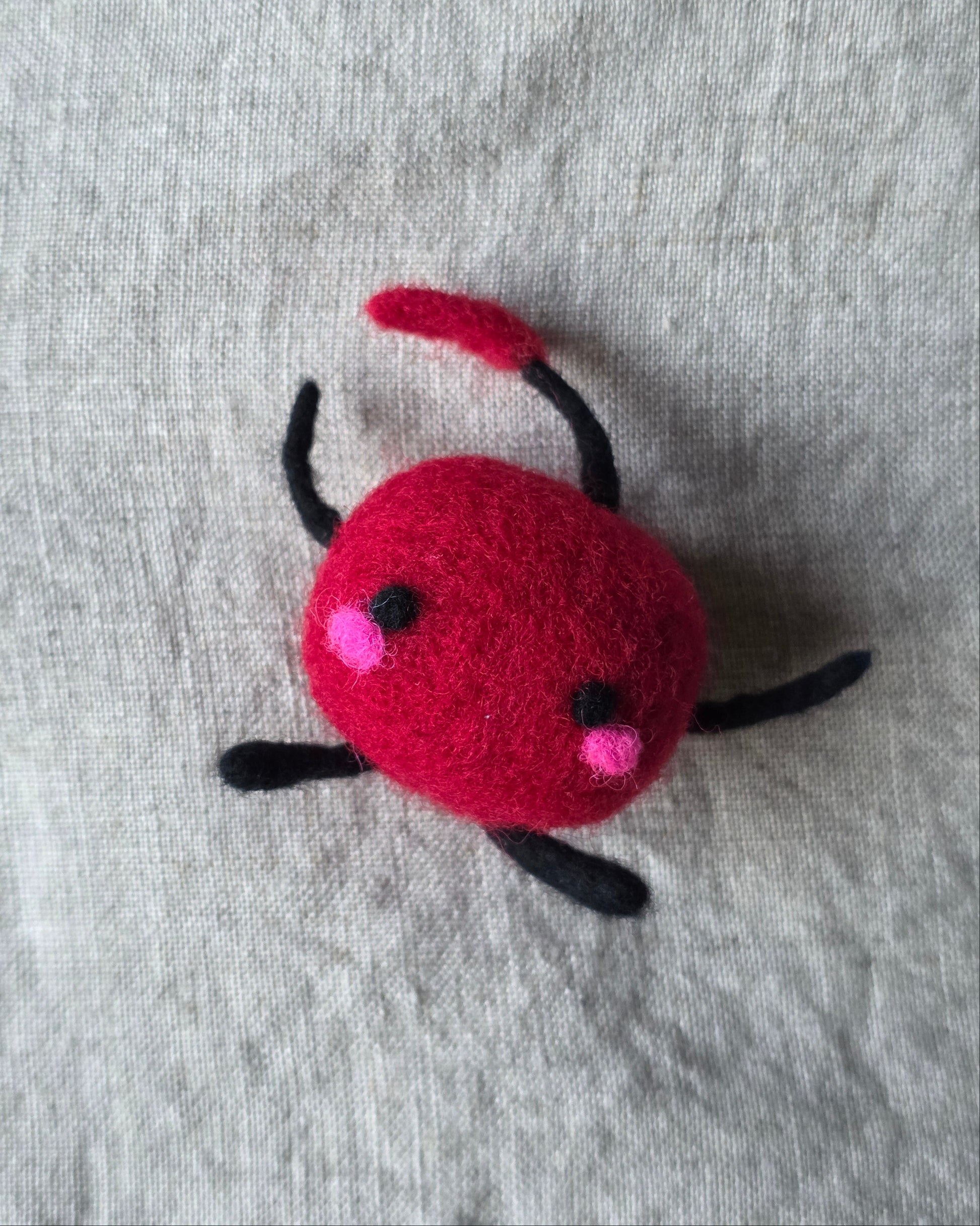An adorable felted Junimo.
